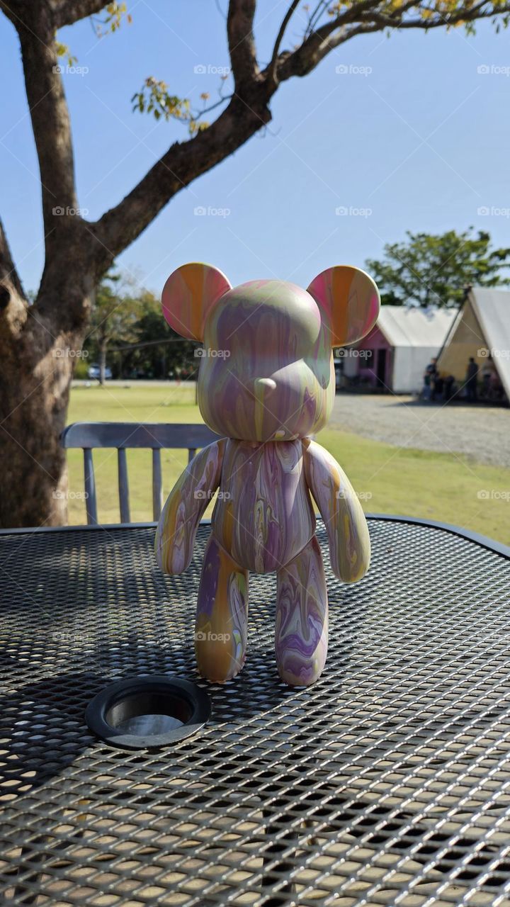 a pouring art toy bear