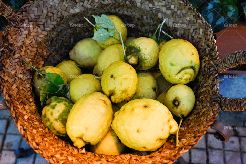 a basket of lemons in Cefalu in Sicily