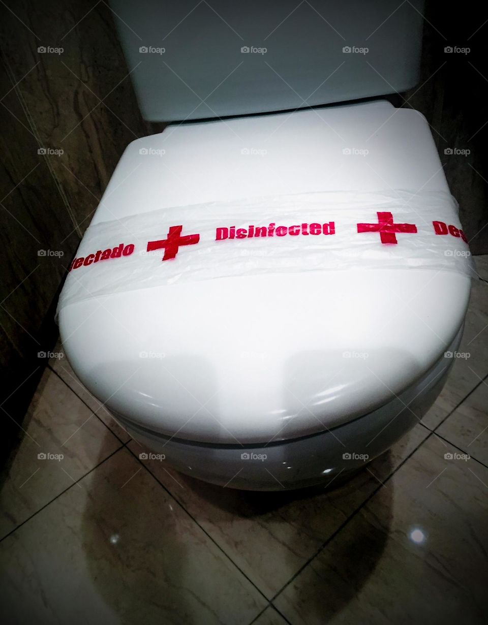 Disinfected toilet bowl in hotel room