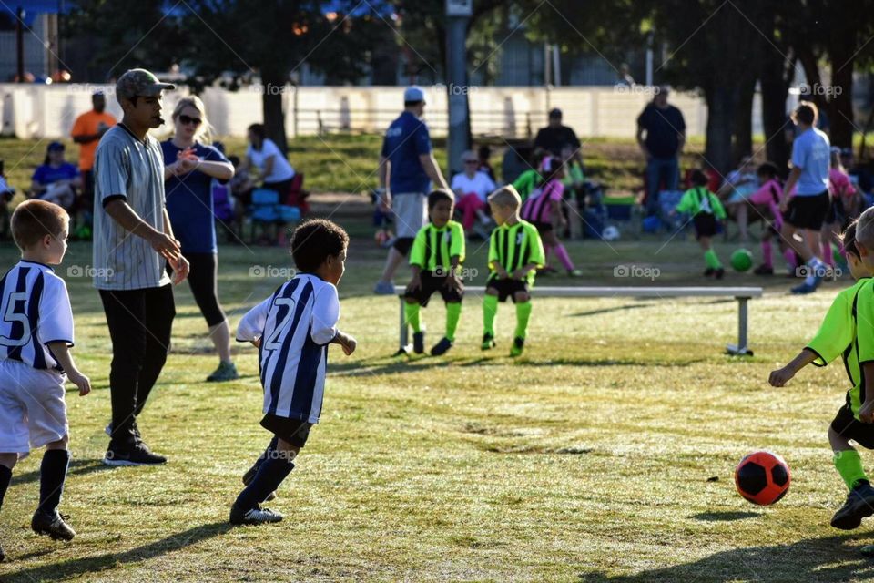 Getting ready to kick the soccer ball takes a lot of concentration. It is important to take a deep breath and just go for it!