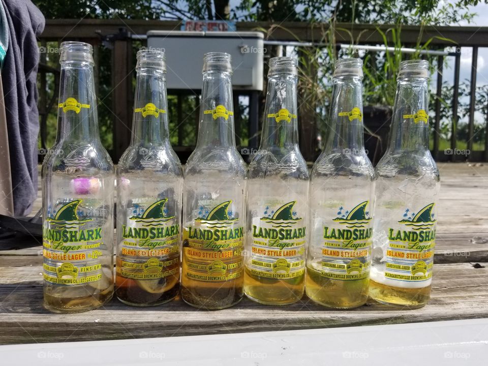 Pool side beer bottles