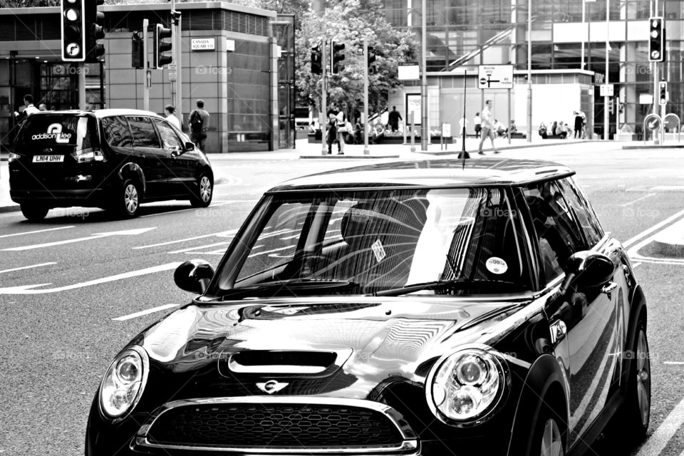 City lines reflected in a car