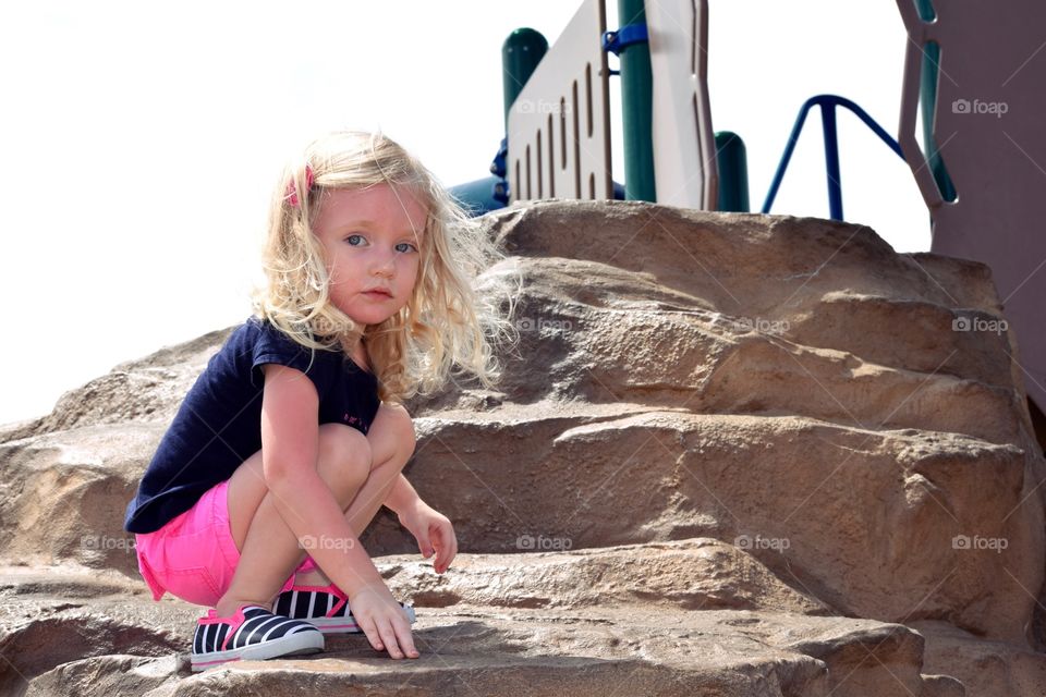 Park. Climbing on rocks