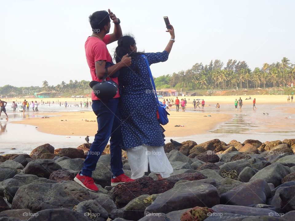 selfie time for couple on the beach 🙂