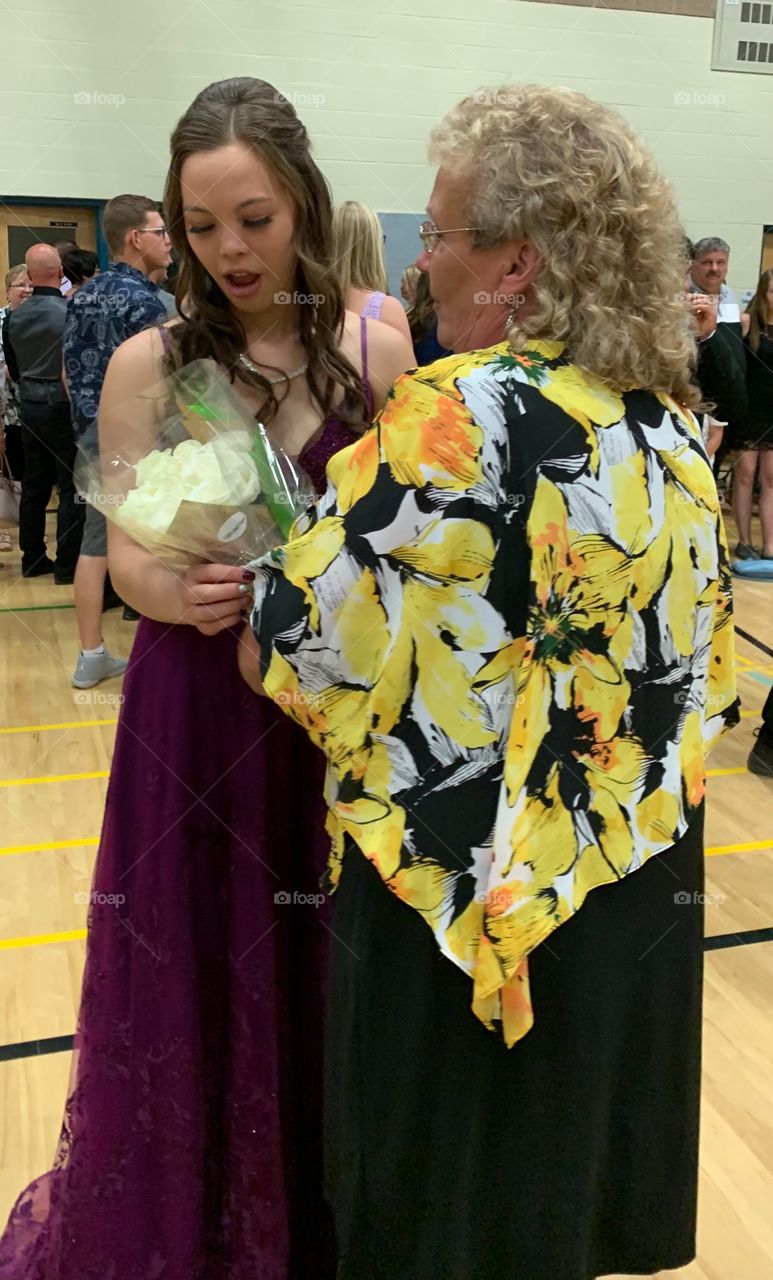 Receiving roses at graduation