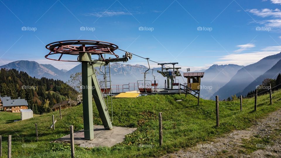 chairlift in Vorarlberg, Austria on a sunny day in fall.