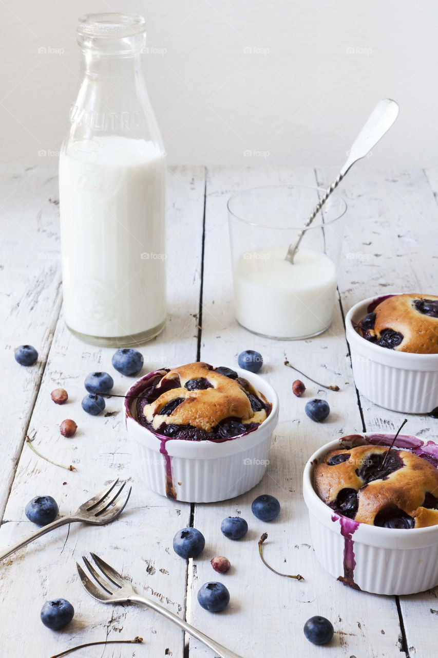 French clafoutis with blueberries and milk bottle