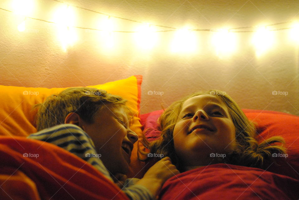 Two brothers telling each other confidences before going to sleep