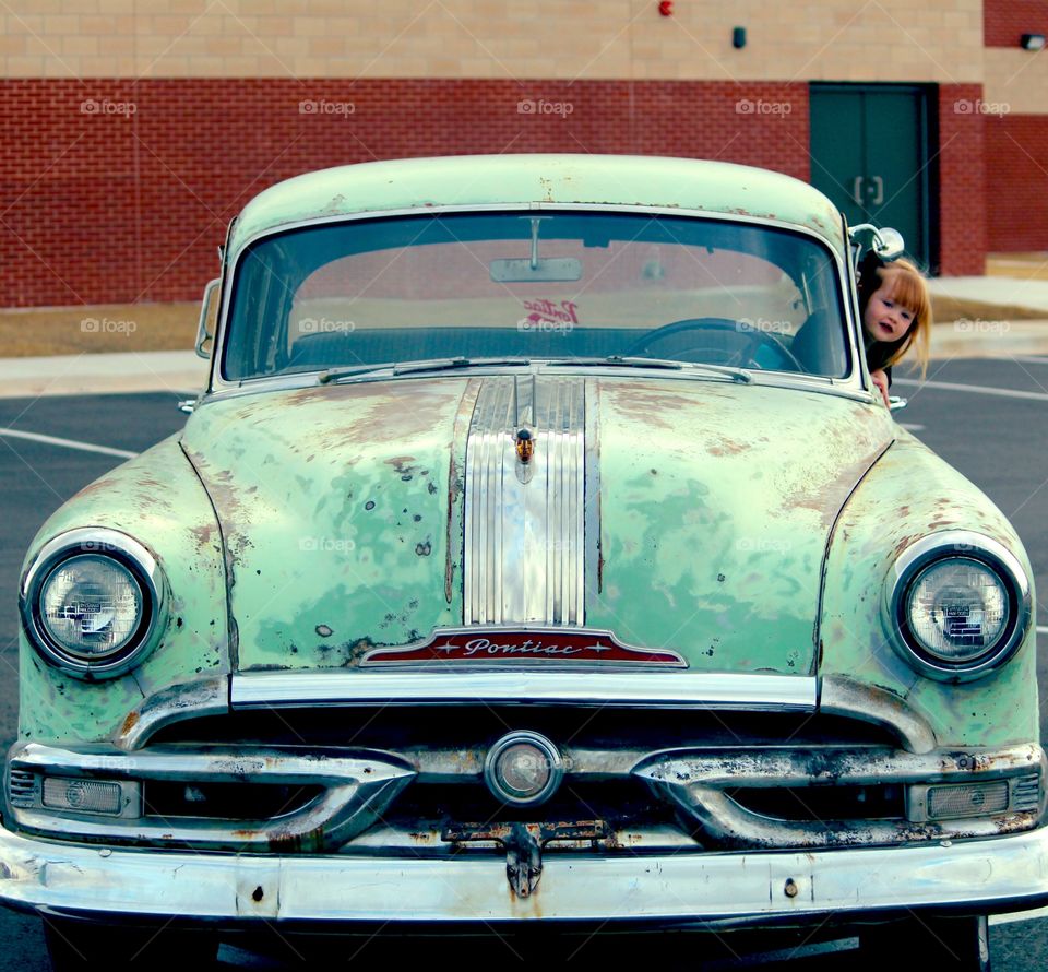 Antique Pontiac with Little Girl Peeking Head Out