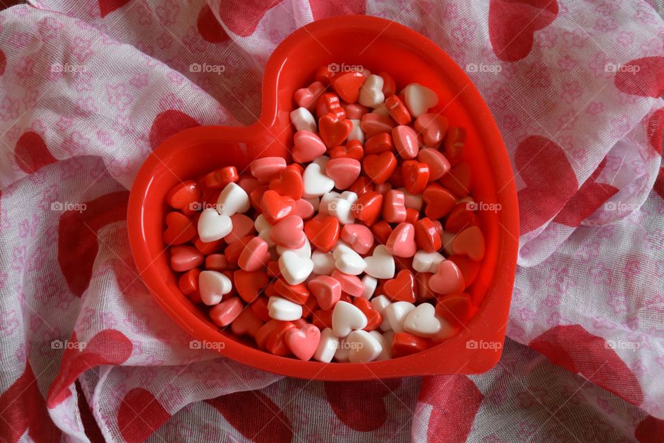 Heart shaped dish full of Valentines candy