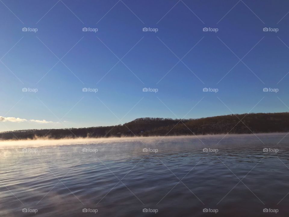 Fog rising on the lake 