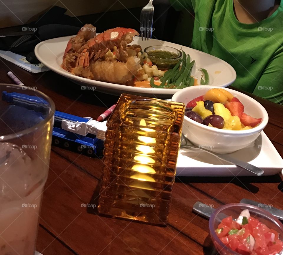 Lobster meal with green beans and fruit at Bahama Breeze in Florida during month of May
