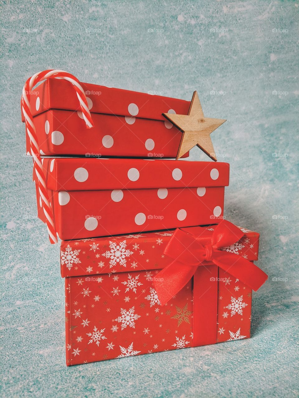 Christmas background of red gift boxes, candies and other festive decorations. Flat lay. Top view.