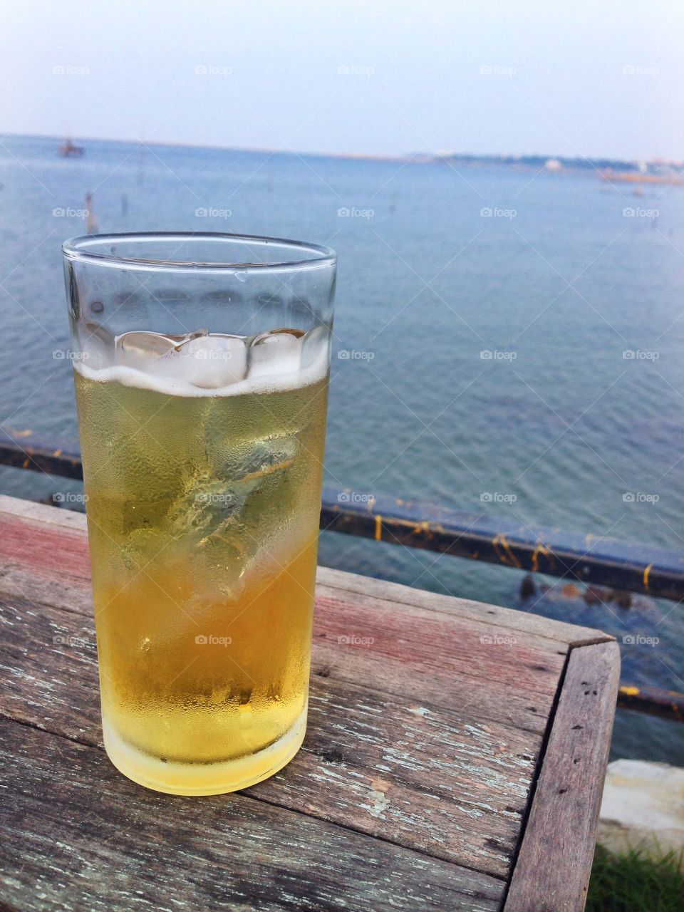 A glass of beer on the sea