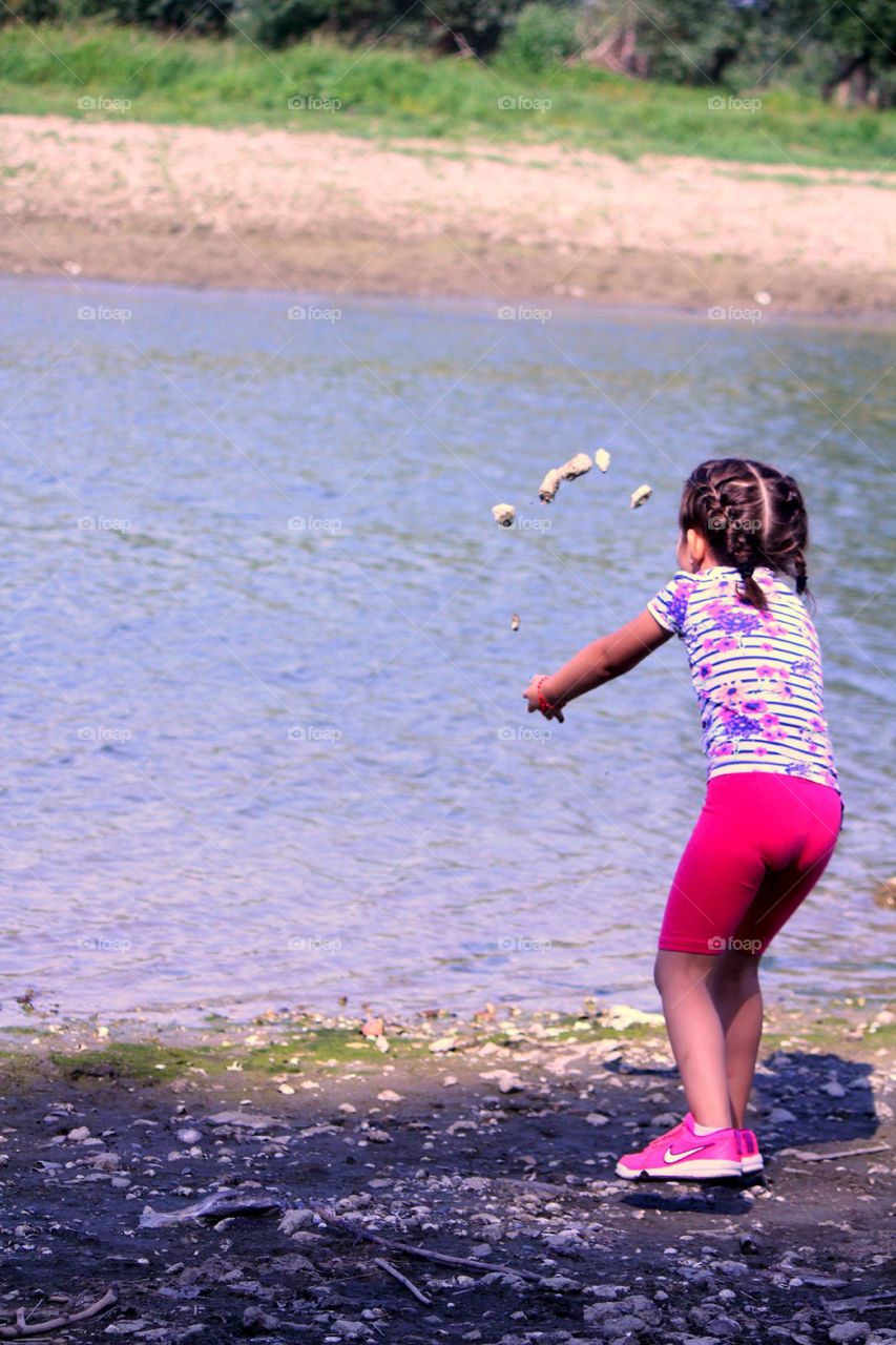 Throwing rocks in the river