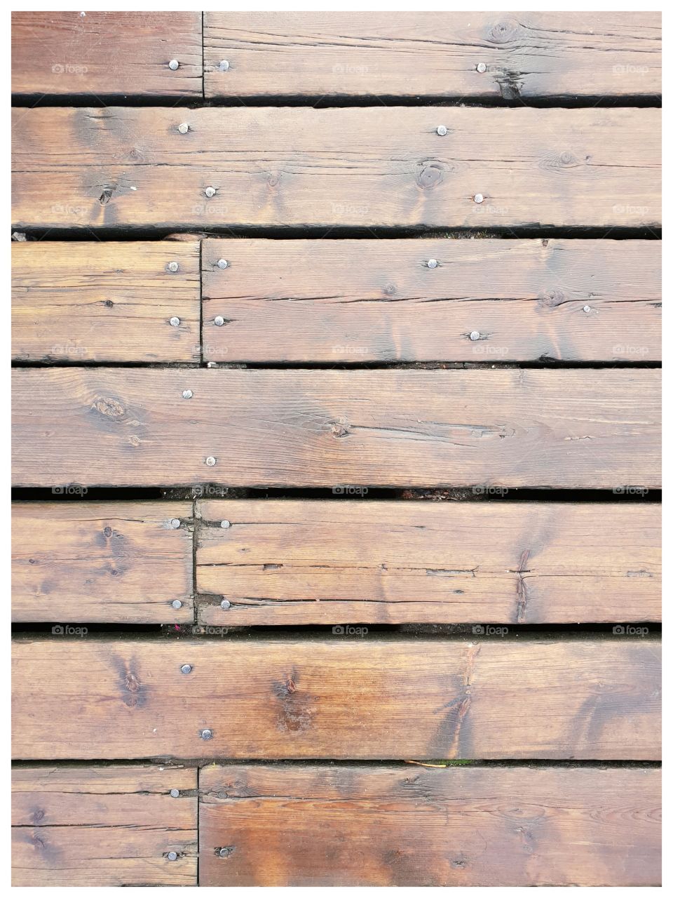 Old wooden floorboards on the docks of Nyhavn, Kopenhagen.