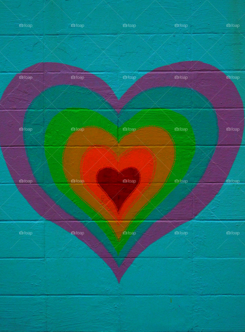 Colorful heart painted on wall
