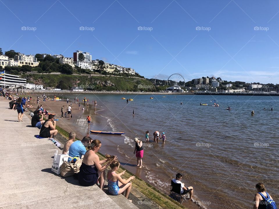 Holiday makers begin to take their places for a warm, very warm hot and rather muggy bank holiday August.