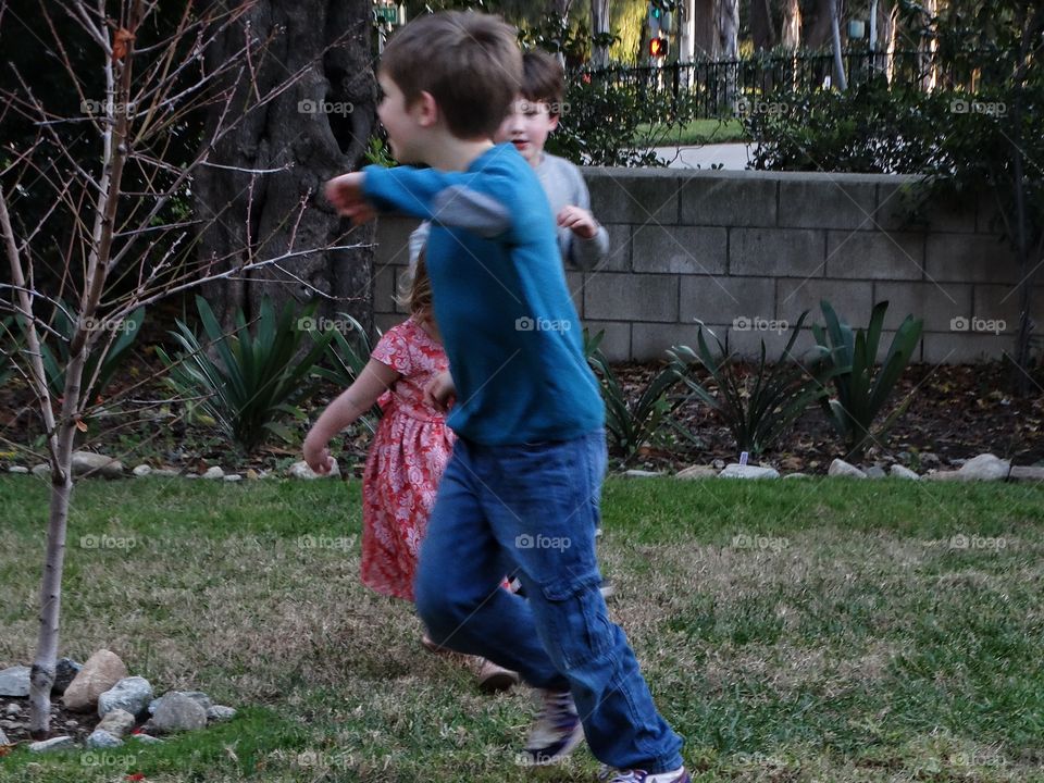 Young Children Playing Tag
