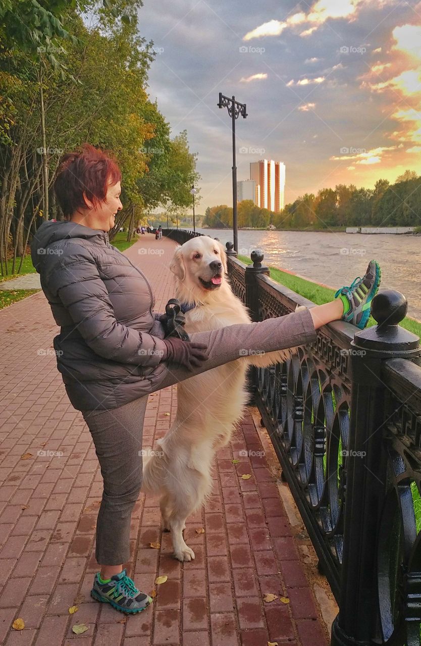 My wife and my dog are stretching up. 