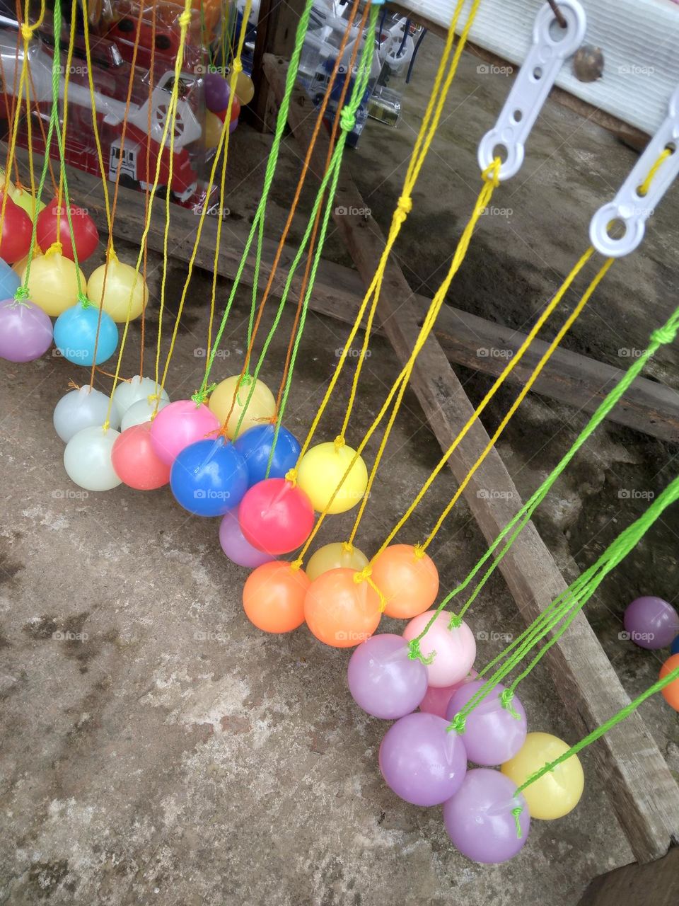 In America, this game is known as Clackers Ball. This game is also known to Italy as 'Lato' in Italian which means side.and in Indonesia it called lato lato