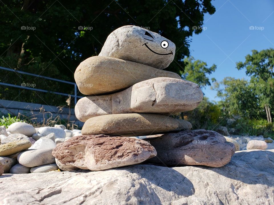 Inuksuk with knowing wink on face cute and funny