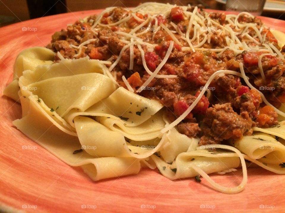 Fresh homemade pappardelle bolognese. 