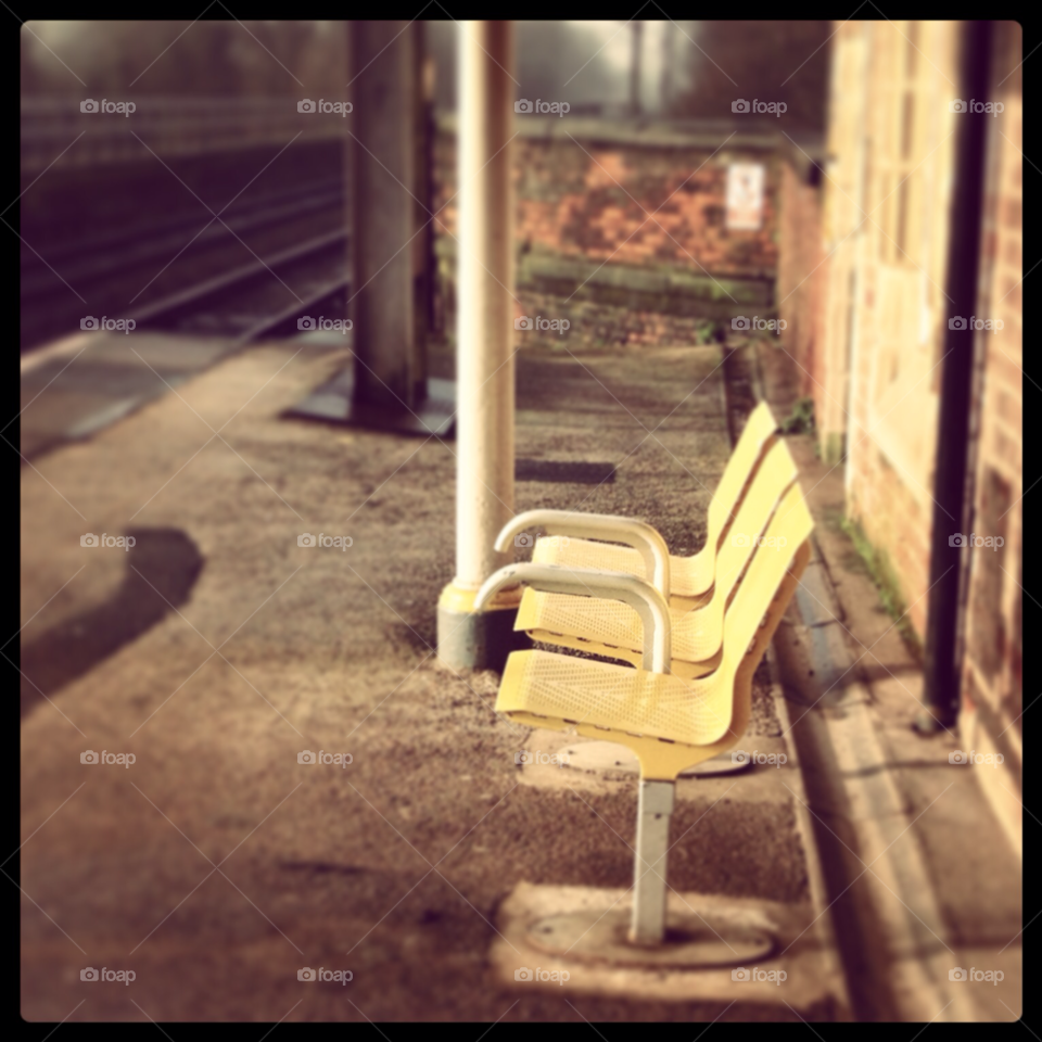 yellow chair train station grungy by KirstyMae