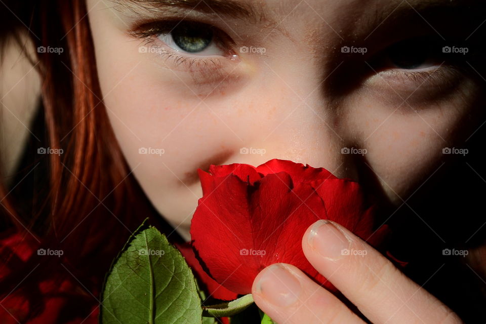 Girl holding red rose
