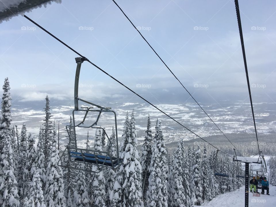 Winter in the chair lift at the ski hill.