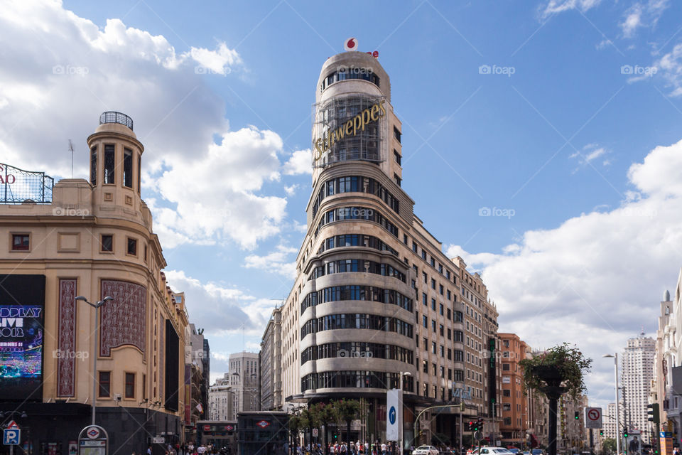 The Callao Square and Gran via street innMadrid Spain inna sunny day full of walking people.