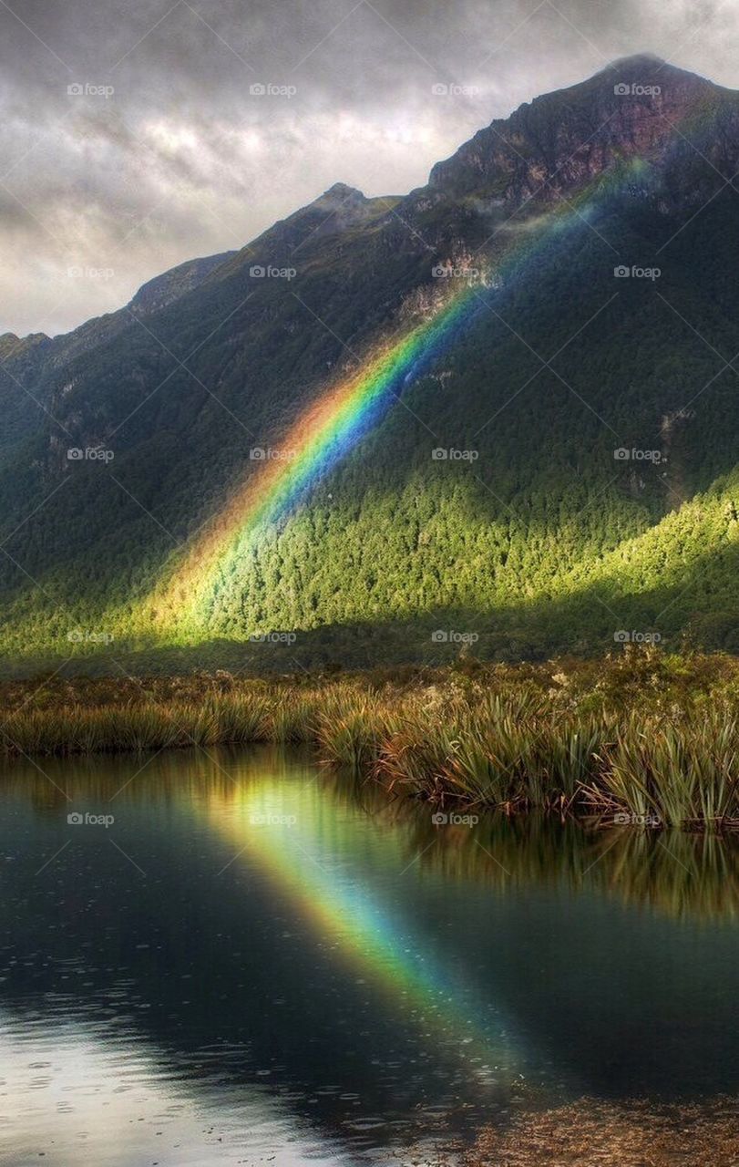 mountain forest lake rainbow by marcinjakobowski
