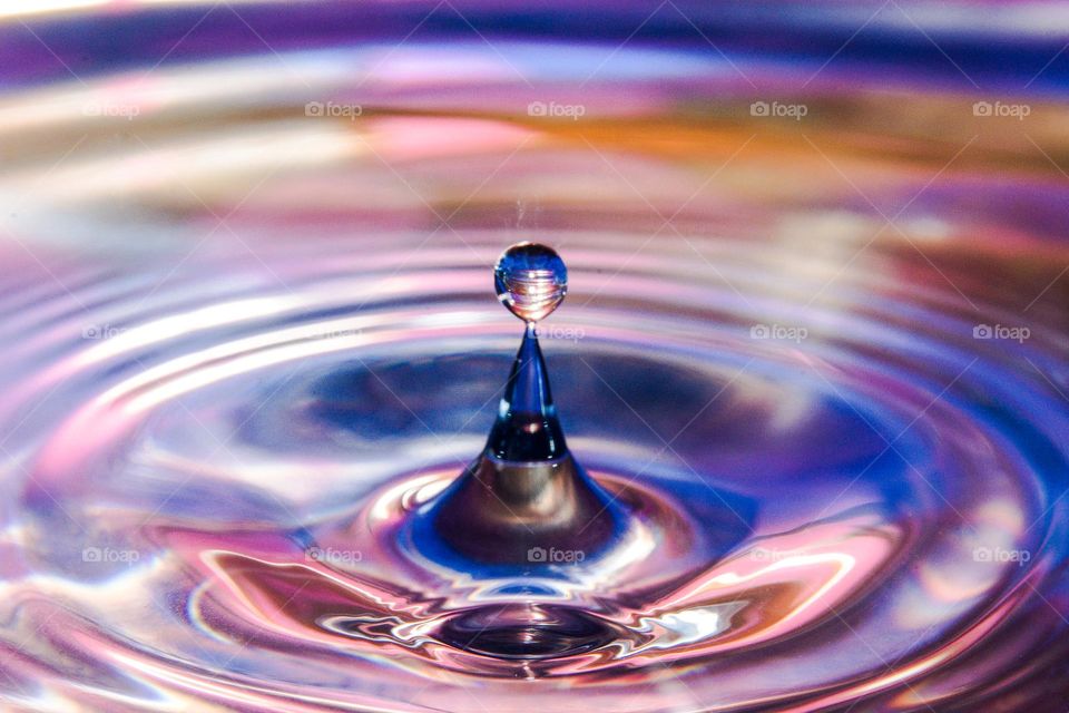 Water drop on a colorful background