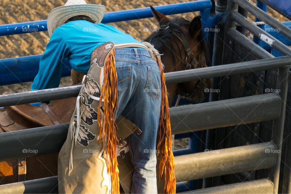 Cowboy Gets Ready for Rodeo Ride