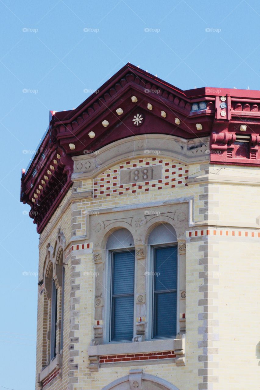 Architectural detail on the front of an historical building, built in 1881