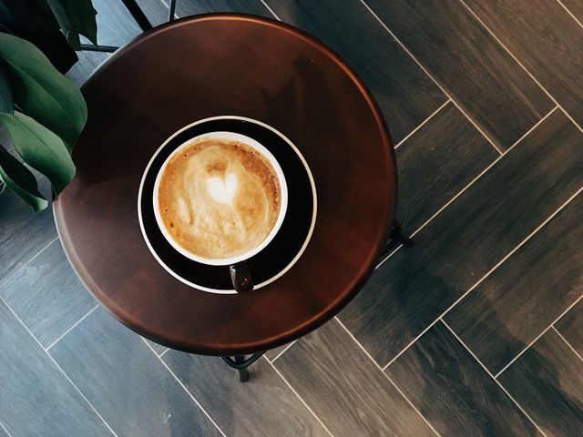 Cup of coffee on the wooden chair 