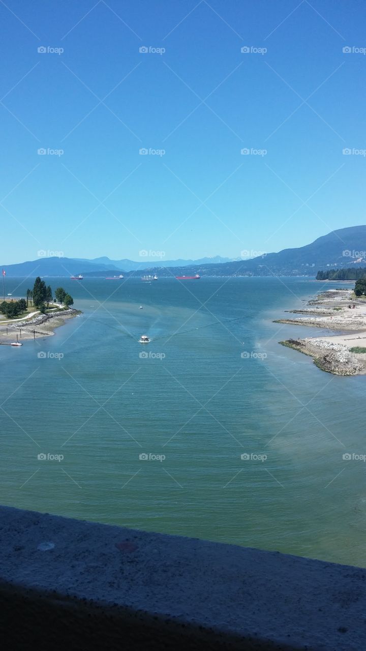 View of English Bay and the beginning of boating season from the Burrard Street Bridge in Vancouver, British Columbia