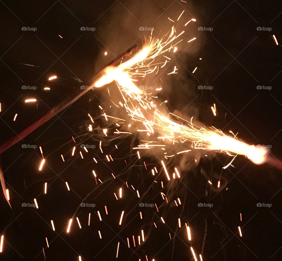 Sparklers on the 4th of July. Reminds me of magic wands!