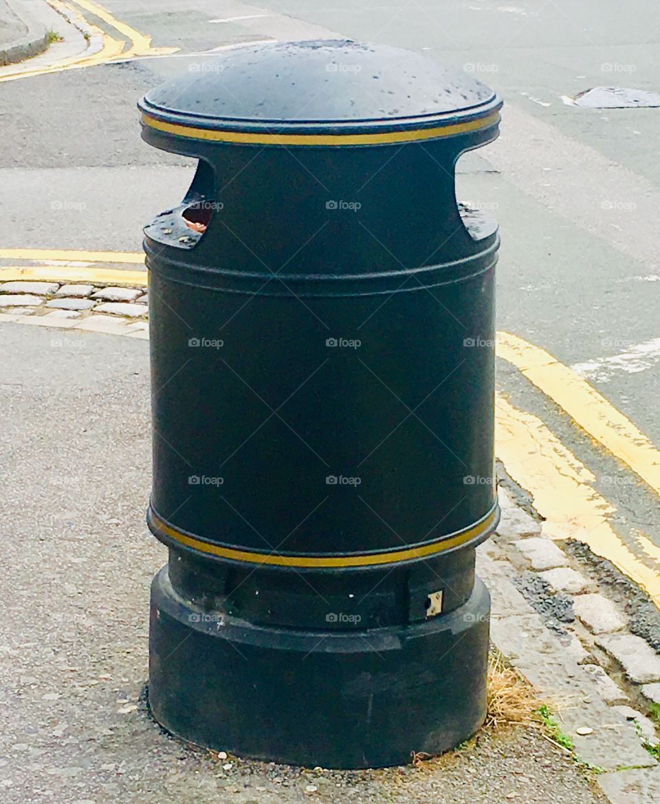 Black waste bin on street, United Kingdom 