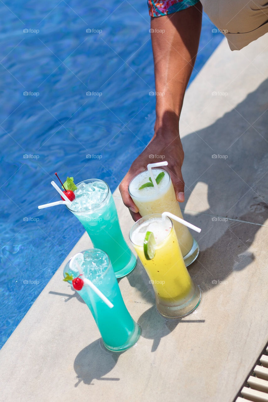 Bartender serving drinks at the poolside