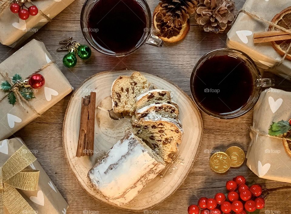 Small wrapped presents with stollen and mulled wine