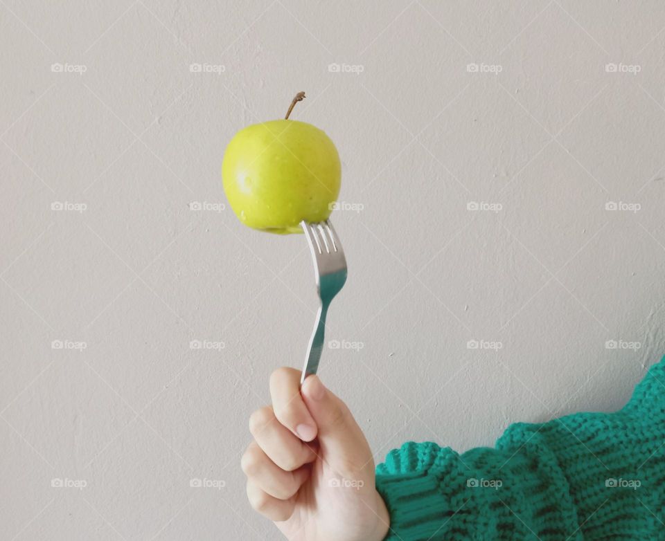 fork with apple.