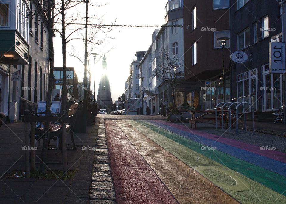 Rainbow road in Reykjavik leading towards Hallgrímskirkja.