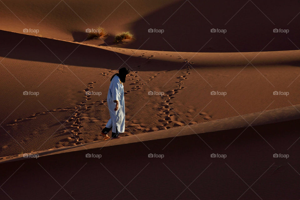 Berber man on sand dune