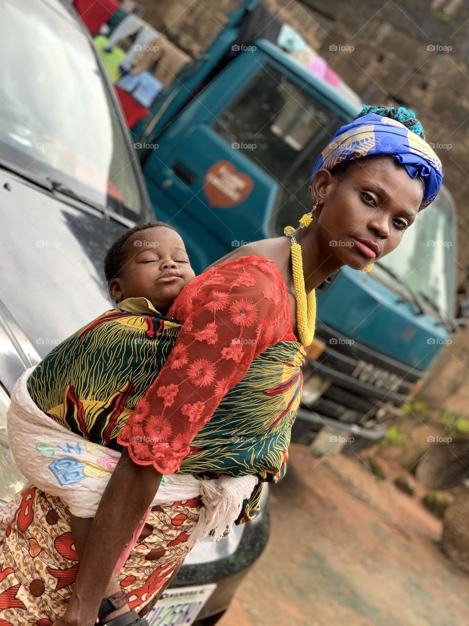 Poor widow with child in eastern part of Nigeria 