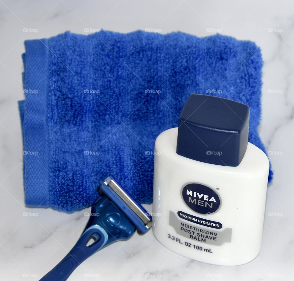 Nivea shaving product with blue towel and blue razor