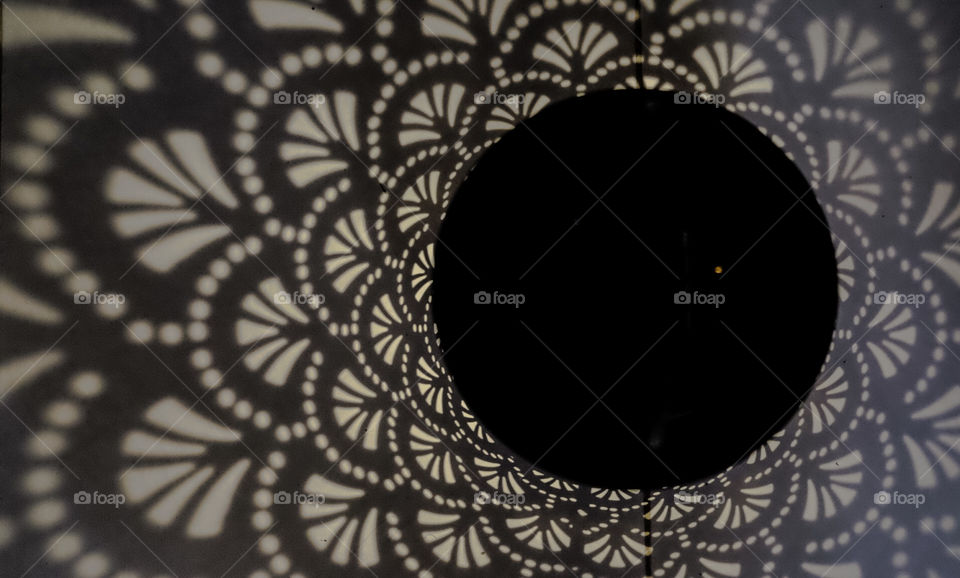 Latern shadow, light patrón over the floor 