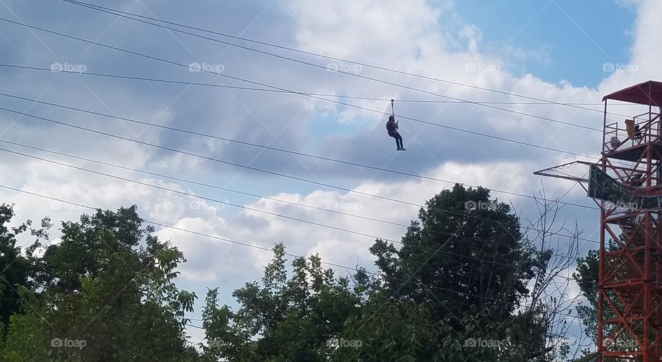 someone zip lining in the mountains of Maşukiye turkey