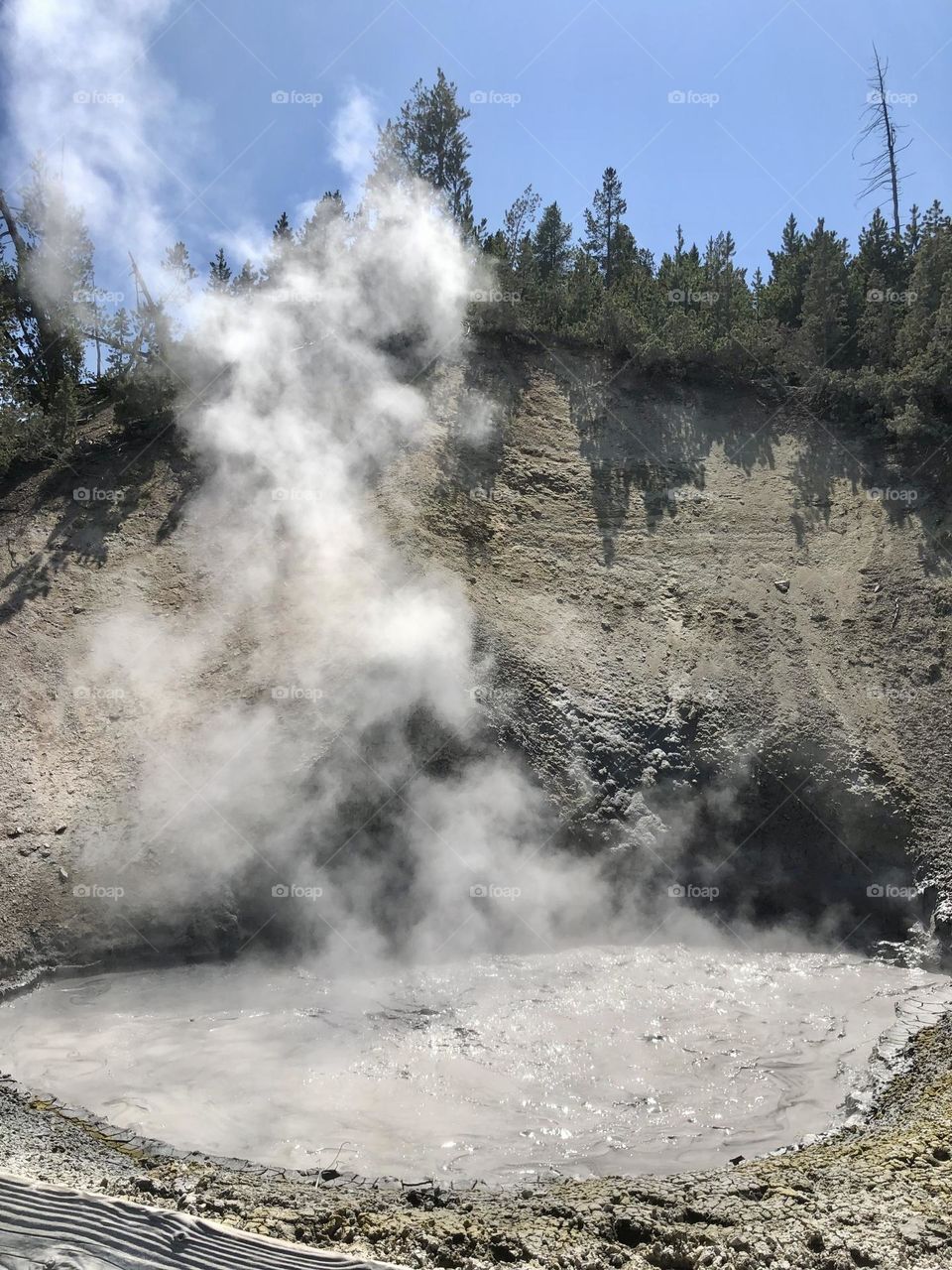 a muddy volcano producing hot smoke