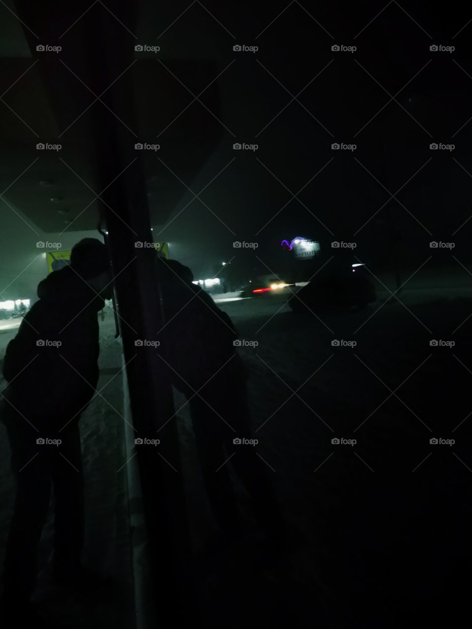 what is there? snowfall in the evening. Closed shop. Siberia. Russia.